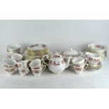 A part Colclough tea and dinner service comprising cups and saucers, various plates, bowls, teapot,