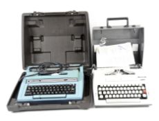 Two vintage typewriters, one by Smith-Corona, the other a Decimo 3002,