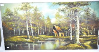 A 20th century oil on canvas landscape depicting a forest scene with hut beside a lake,