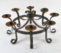 A wrought iron ceiling fixture, possibly a eight branch candelabra,
