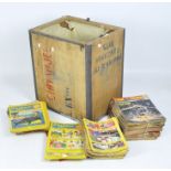 A large collection of vintage comics, comprising mostly Playhour, in a wooden crate