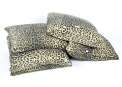 Five contemporary black and yellow leopard print cushions,