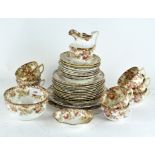 A 19th century part tea service, including plates, cups and saucers, a milk jug and bowls,