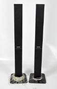 A pair of Panasonic speakers, TT9DA001107, within black plastic cases, height 112cm.