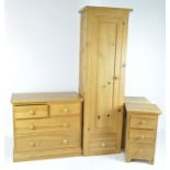 A selection of contemporary pine furniture, including bedside cabinets, chest of drawers, wardrobe
