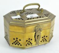 An Indian brass cricket box of octagonal form, pierced with rounded cross patterns,