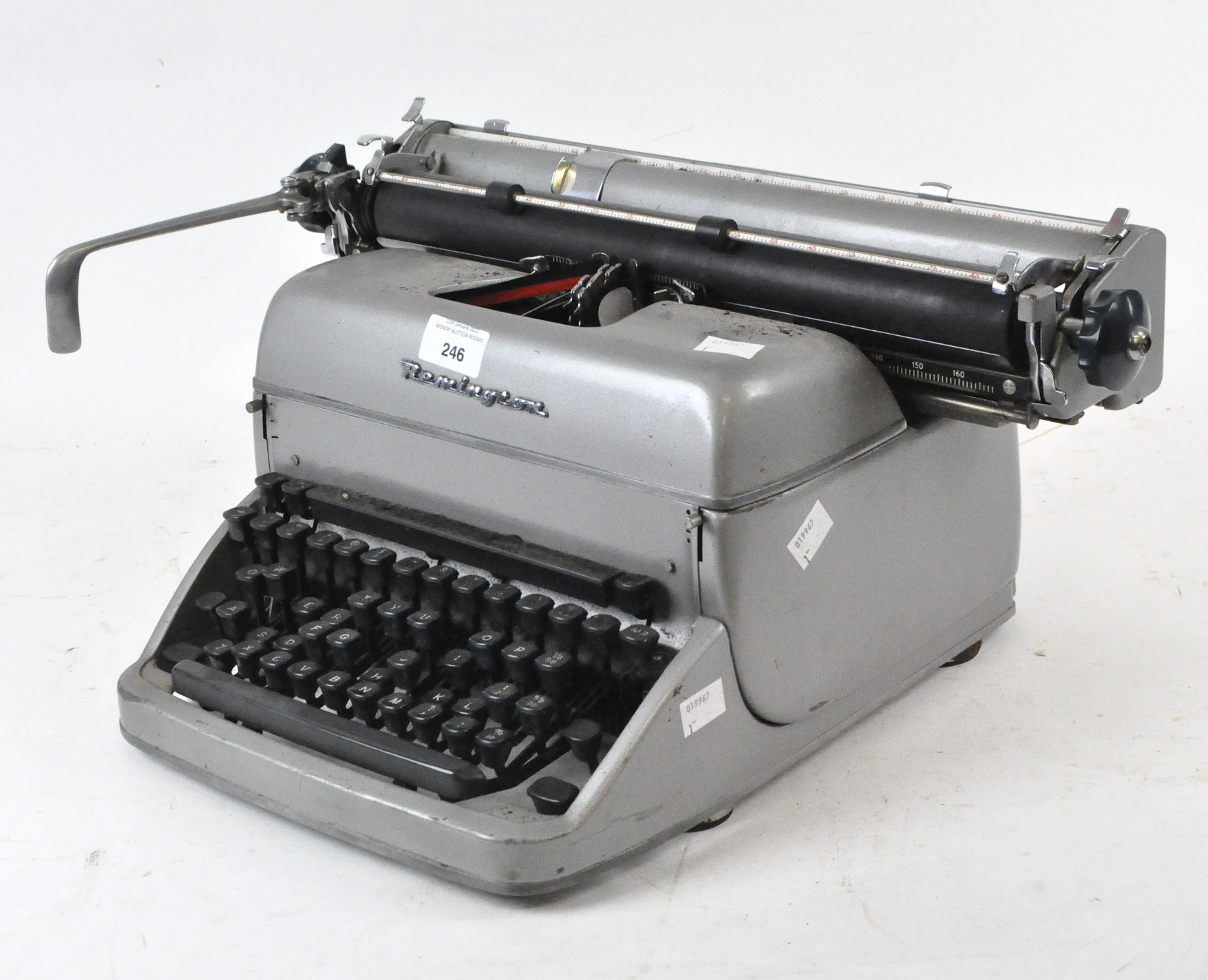 A vintage Remington manual typewriter, the silver metal body with black keys,