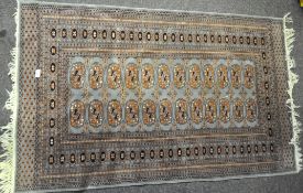 A silk blend floor rug with cream tassels