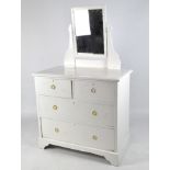 A 20th century dressing table, the rectangular top supporting a hinged mirror,