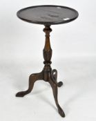 A late 19th/early 20th century mahogany wine table, raised on cabriolet tripod legs,