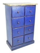 A 20th century blue painted pine chest of drawers, comprising eight matching drawers,