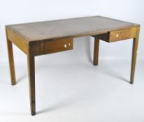 An early 20th century oak desk, possibly military, with an inset top and two drawers,