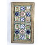 A Minton Stoke-on-Trent tile stand, the two tiles featuring entwined flowers,