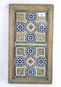 A Minton Stoke-on-Trent tile stand, the two tiles featuring entwined flowers,