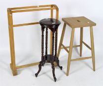 A contemporary stool together with a jardiniere stand and a clothes racks,