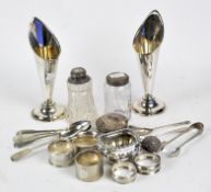 A collection of silver and silver plate, including a set of four teaspoons, pair of sugar tongs,