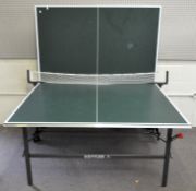 A Kettler folding table tennis table, on wheels,