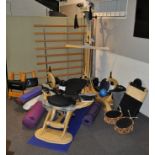 A large collection of gym related equipment including a Gyrotonic Cobra workout machine,