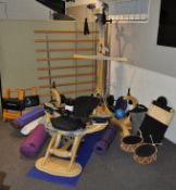 A large collection of gym related equipment including a Gyrotonic Cobra workout machine,