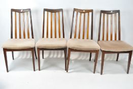 A set of four vintage G-Plan chairs, with upholstered seats, on tapering supports,