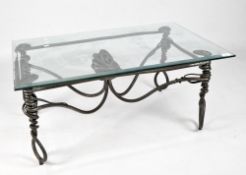 A contemporary glass topped table,