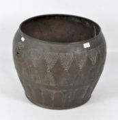 A large cast metal planter, the copper structure decorated with lions and textured decoration,