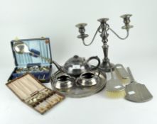 A selection of 20th century silver plated wares, to include a candlestick, brushes, a hand mirror,