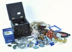 A quantity of costume jewellery and more within a carved wooden box