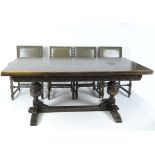 An early 20th century extendable wooden refectory table,