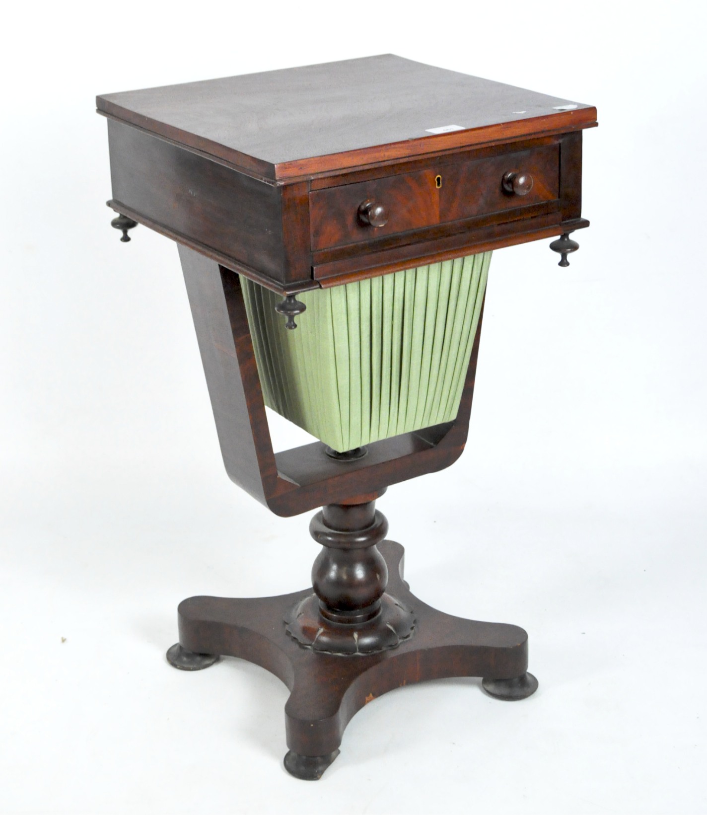 A Victorian style mahogany sewing table, with drawer and tapering silk clad sewing box,