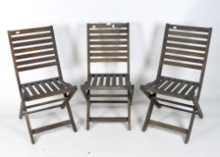 Three wooden folding garden chairs,