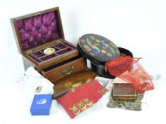 A wooden jewellery box and a selection of costume jewellery, including a coral necklace