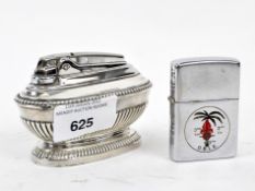 A Ronson and a Zippo lighter, the former a table lighter with moulded decoration,