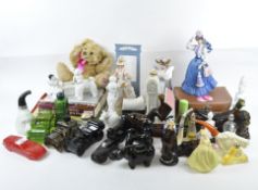 A collection of novelty Avon perfume bottles and collectables, including cars,