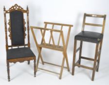 Two chairs and a folding print stand,