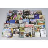 A large quantity of autobiographies and reference books regarding cooking and photography,