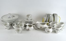 An extensive Royal Douton 'Tumbling Leaves' tea and dinner service comprising cups and saucers,