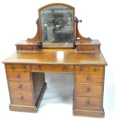 A late 19th/early 20th century mahogany dressing table with mirror,