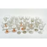 A selection of drinking glasses, comprising wine glasses, spirit glasses and cocktail glasses,