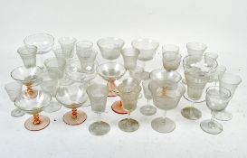 A selection of drinking glasses, comprising wine glasses, spirit glasses and cocktail glasses,