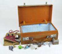 A vintage leather briefcase and contents including a small selection of costume jewellery,