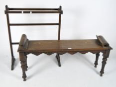 A Victorian mahogany window seat, with flowing apron raised upon turned supports,