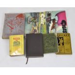 A collection of vintage books, including two Giles cartoon books,
