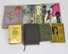 A collection of vintage books, including two Giles cartoon books,