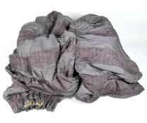 A set of large purple curtains with related accessories,