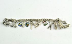 A silver charm bracelet, with fourteen charms