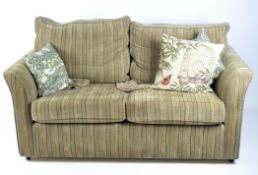 A Wesley-Barrell two seat sofa with striped upholstery, with three additional cushions,