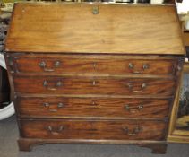 A 19th century mahogany bureau, the drop front opening to reveal fitted interior,