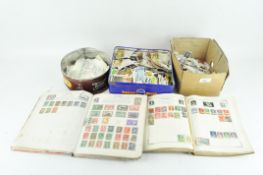 A collection of cigarette cards and 20th century British and World stamps in albums
