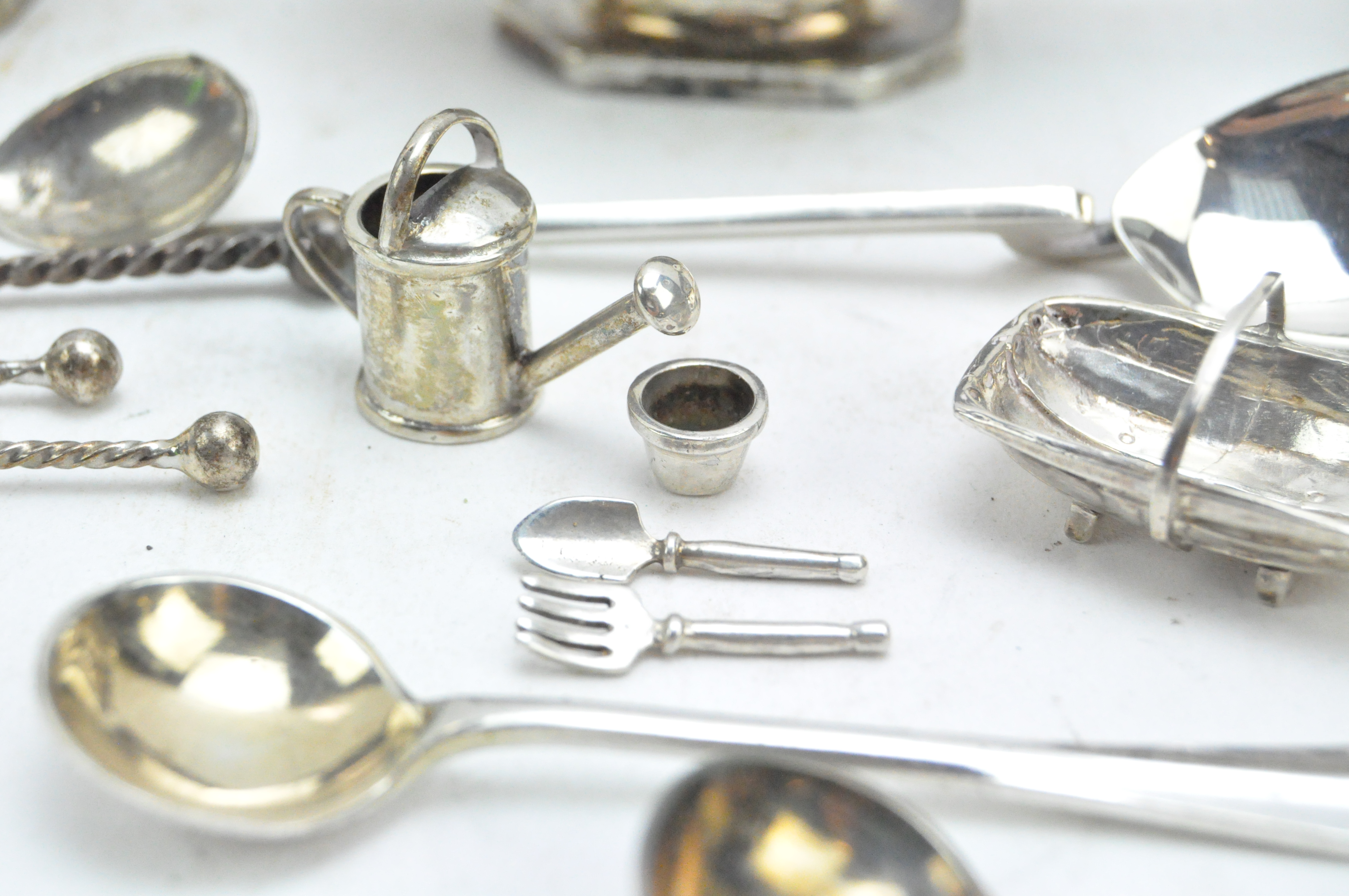 A collection of 19th & 20th century silver, including a condiment set, spoons, charms and more, - Image 3 of 5